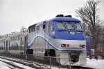 Commuter train shoves west out of the station